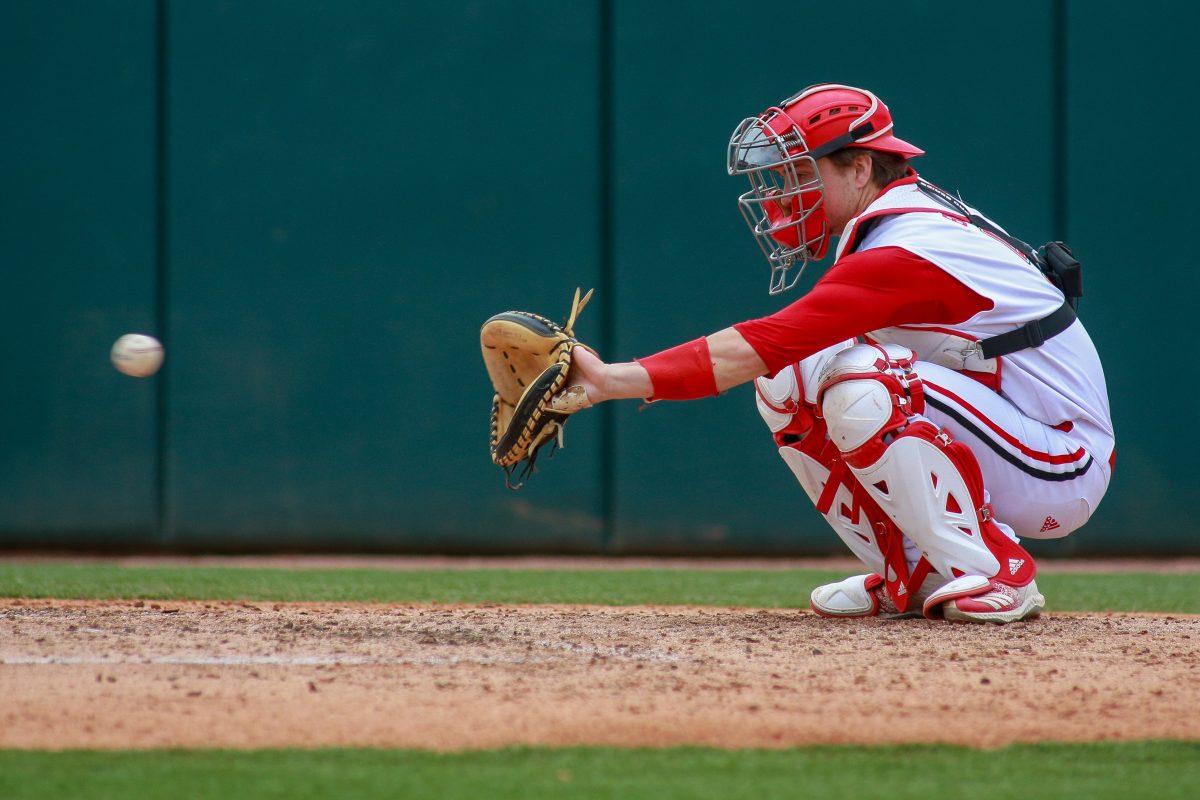 Sophomore catcher Patrick Bailey catches the ball during the game against Virginia at Doak Field on Sunday, March 31, 2019. NC State beat Virginia 8-7.