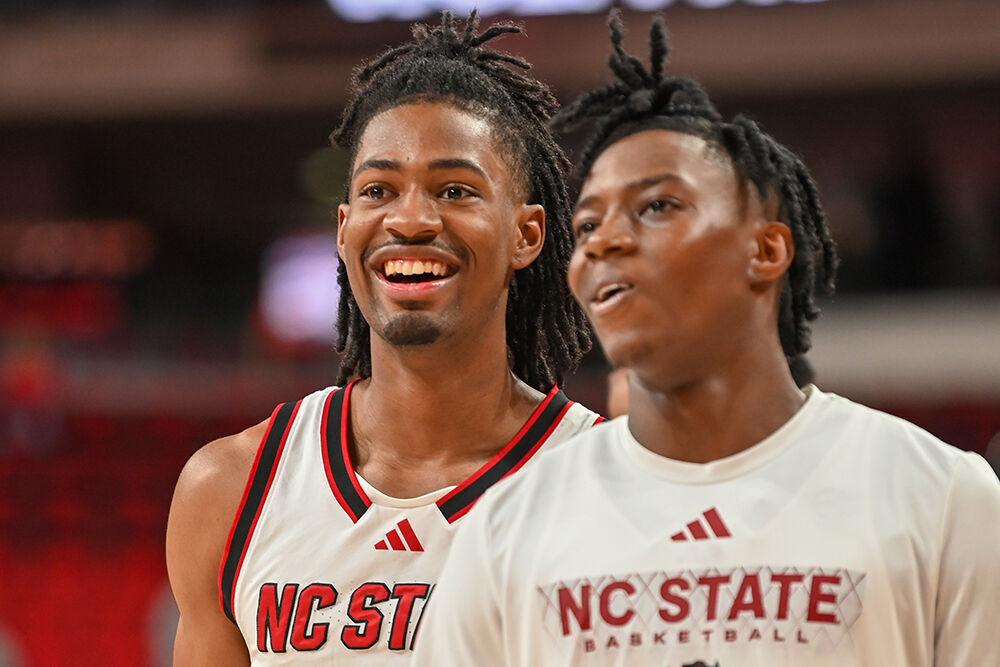 Freshman guard Bryce Heard smiles while warming up before the game against Coastal Carolina in the Lenovo Center on Wednesday, Nov. 13, 2024. The Wolfpack won against the Chanticleers 82-70.