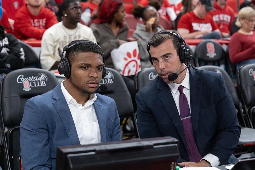Former NC State basketball star Casey Morsell speaks with fellow commentator Evan Budrovich during the game against Coastal Carolina in the Lenovo Center on Wednesday, Nov. 13, 2024. Morsell played for the Wolfpack from 2021 to 2024. NC State won the game 82-70.