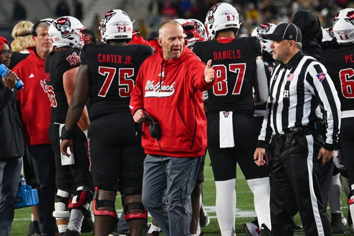 NC State head coach Dave Doeren expresses frustration to a referee during the game against Georgia Tech in Bobby Dodd Stadium at Hundai Field in Atlanta on Thursday, Nov. 21, 2024. NC State lost to Georgia Tech 30-29.