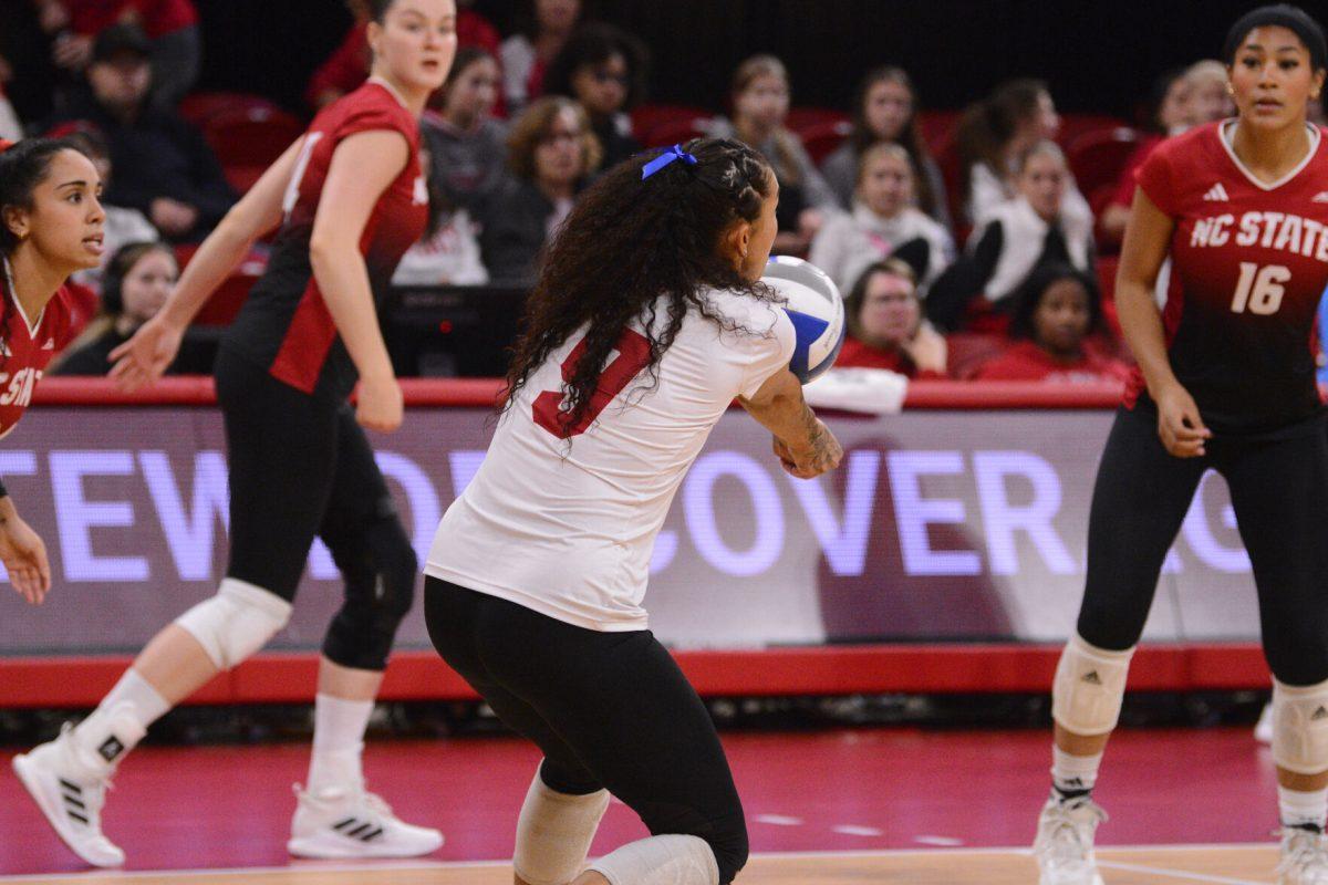 Graduate defensive specialist/libero Skye Stokes passes the ball during the match against SMU at Reynolds Coliseum on Friday, Nov. 22, 2024. Stokes had four assists and 16 digs. The Wolfpack lost to the Mustangs 3-2.
