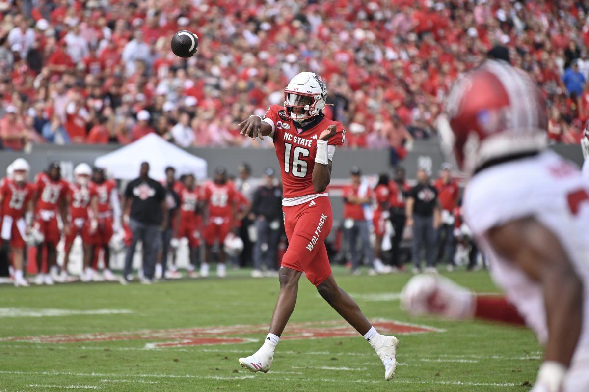 Freshman quarterback CJ Bailey throws a touchdown to junior tight end Justin Joly during NC State's game against Stanford in Carter-Finley Stadium on Saturday, Nov. 2, 2024. Bailey passed for 234 yards and three touchdowns. The Wolfpack beat the Cardinal 59-28.