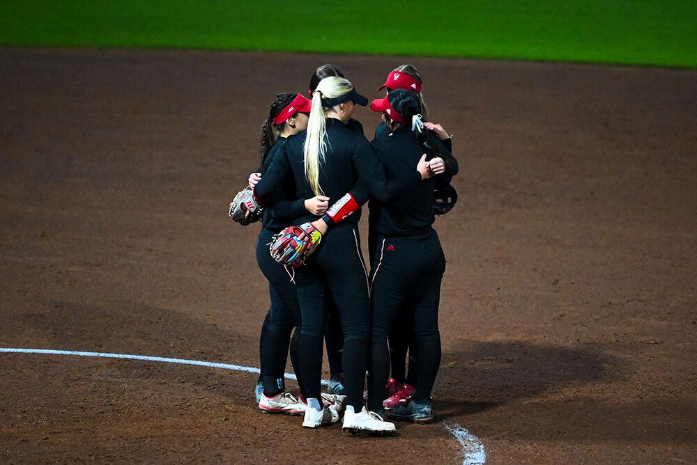 The infield huddles up in between batters during the Wolfpack's fall practice game against Barton College at Dail Softball Stadium on Friday, Nov. 15, 2024. Since this was a practice game, no score was kept.