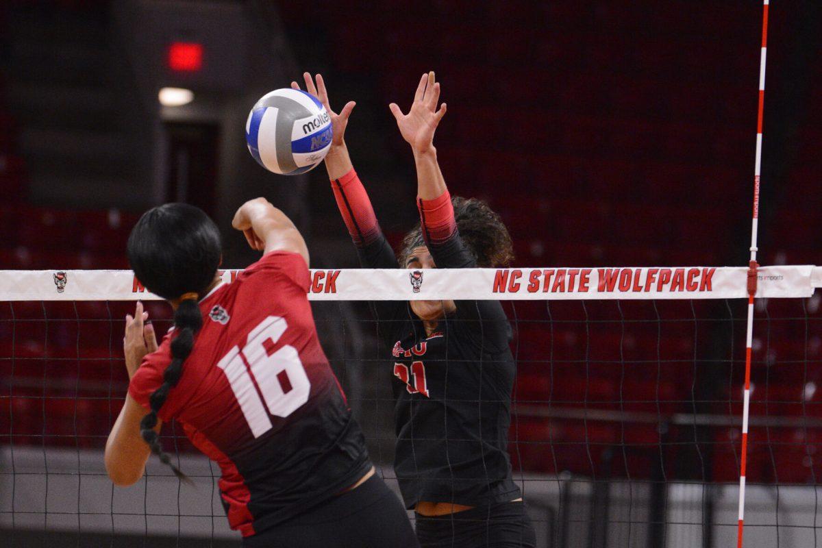 Senior middle blocker Jada Allen prepares to attack the ball during the match against SMU at Reynolds Coliseum on Friday, Nov. 22, 2024. Allen had one assist and two digs. The Wolfpack lost to the Mustangs 3-2.