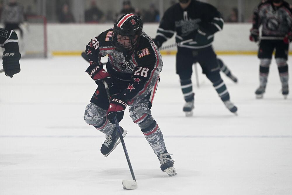 Freshman forward Jake Gifford takes control of the puck during the game against Michigan State at the Invisalign Arena on Friday, Nov. 8, 2024. NC State beat Michigan State 4-2.
