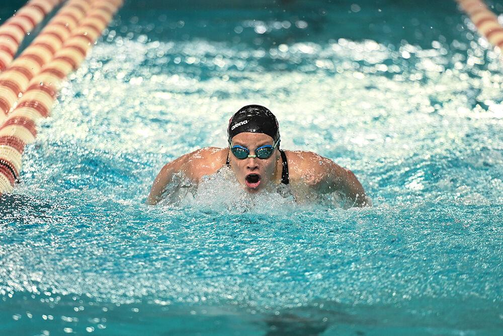 Freshamn Grace Monahan bursts out of the water in the women's 200 yard butterfly during the NC State Wolfpack's swim and dive meet against the UNC-Wilmington Seahawks at the Willis R. Casey Aquatics Center on Friday, Jan. 27, 2023. The Wolfpack women beat the Seahawks 186-105.