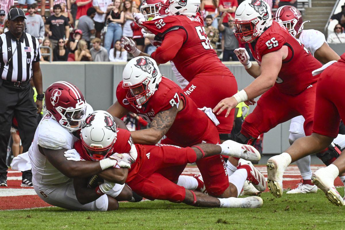 Sophomore wide receiver KC Concepcion falls with the ball during the game against Stanford at Carter-Finley Stadium on Saturday, Nov. 2, 2024. Concepcion earned 30 receving yards during the game. NC State beat Stanford 59-28.