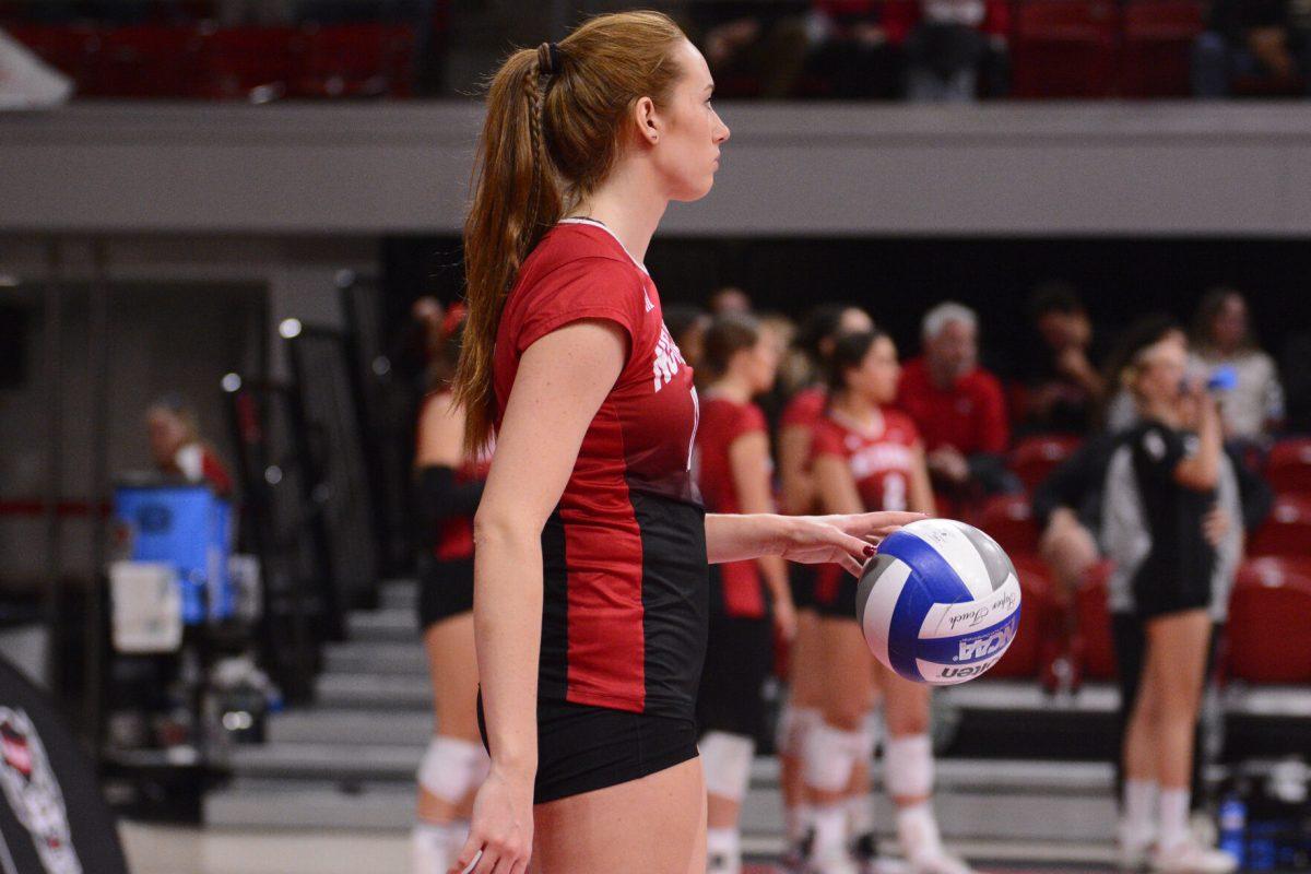 Senior opposite Amanda Rice prepares to serve the ball during the match against SMU at Reynolds Coliseum on Friday, Nov. 22, 2024. Rice had five digs and scored 21 points. The Wolfpack lost to the Mustangs 3-2.