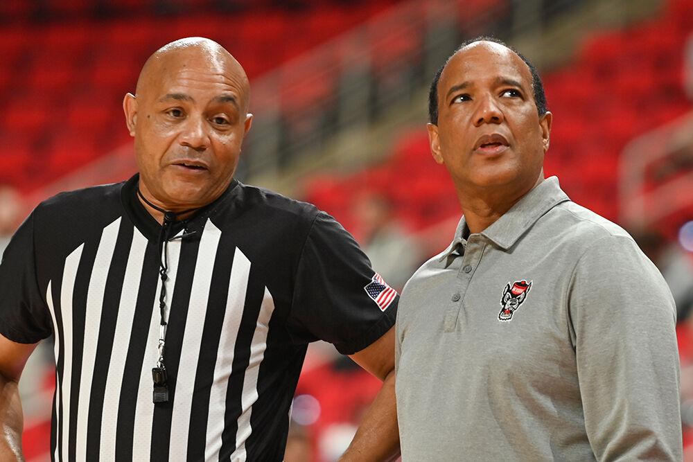 Head coach Kevin Keatts talks to an official during the exhibition game against Lees-McRae in the Lenovo Center on Wednesday, Oct. 30, 2024. The Wolfpack won 79-75 over the Bobcats.