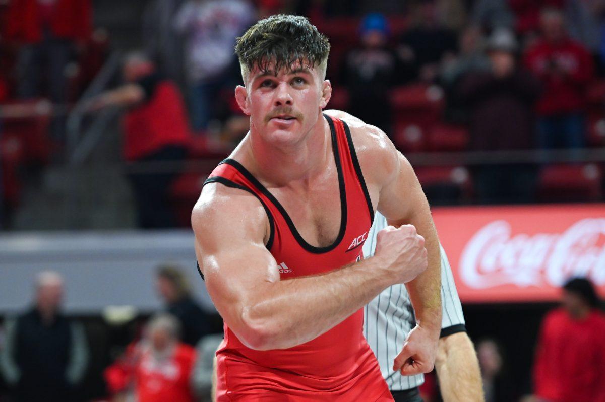 Redshirt junior Isaac Trumble celebrates his win in the heavyweight bout against Utah Valley in Reynolds Coliseum on Saturday, Nov. 23, 2024. Trumble defeated his opponent by technical fall 19-3. NC State beat Utah Valley 23-16.