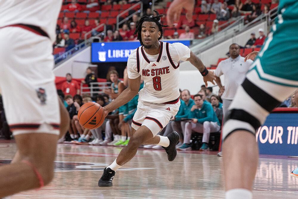 Senior guard Jayden Taylor rushes towards the goal during the game against Coastal Carolina in the Lenovo Center on Wednesday, Nov. 13, 2024. Taylor scored 22 points for the Wolfpack. NC State won the game 82-70.