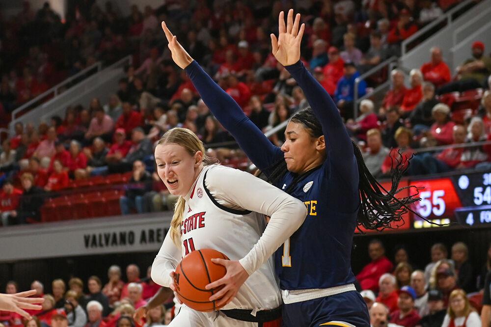 Sophomore forward Maddie Cox moves around an opponent in the game against Kent State in Reynolds Coliseum on Thursday, Nov. 14, 2024. Cox made two rebounds and two assists. NC State won the game 79-51.
