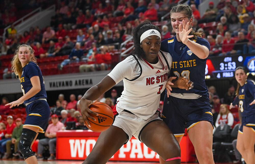 Freshman center Lorena Awou attempts to navigate around her opponent during the game against Kent State in Reynolds Coliseum on Thursday, Nov. 14, 2024. The Wolfpack defeated Kent State 79-51.