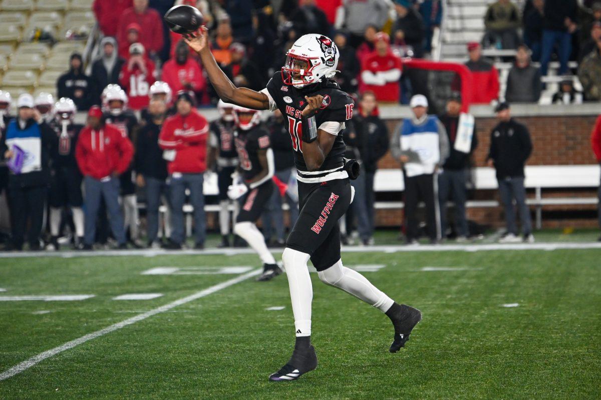 Freshman quarterback CJ Bailey throws a pass during the game against Georgia Tech in Bobby Dodd Stadium at Hundai Field in Atlanta on Thursday, Nov. 21, 2024. Bailey rushed for 83 yards and three touchdowns. NC State lost to Georgia Tech 30-29.