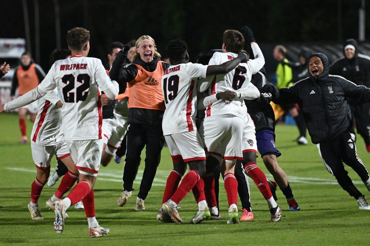 The Wolfpack players run onto the field to celebrate after NC State's NCAA first round game against Charlotte at Dail Soccer Field on Thursday, Nov. 21, 2024. The Wolfpack beat the 49ers 2-1 off of a golden goal score in double overtime to send the team to the next round of the post season.