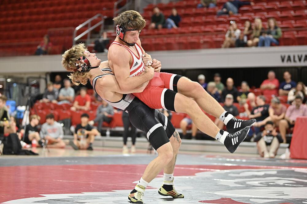 Redshirt senior Kai Orine lifts freshman Gavin Linsman for a mat return at Wrestle-Offs in Reynolds Coliseum on Saturday, Oct. 26, 2024. Orine won via technical fall against Linsman 18-2.