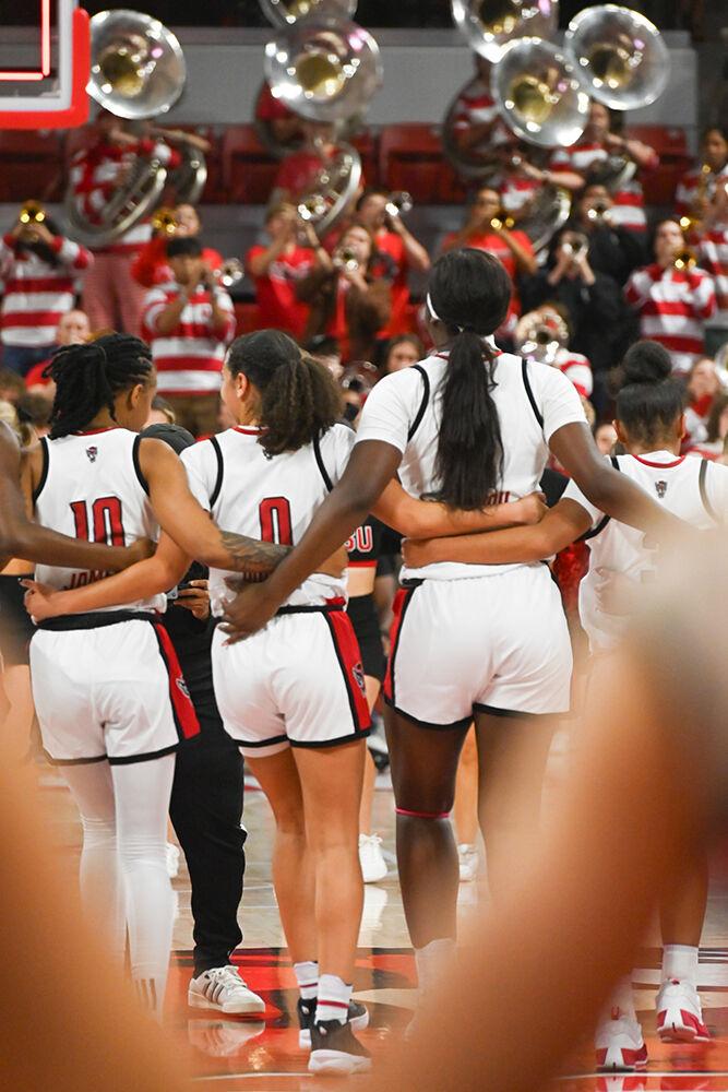 The women's basketball team celebrates their win after the game against Coastal Carolina in Reynolds Coliseum on Thursday, Nov. 21, 2024. NC State beat Coastal Carolina 89-68.