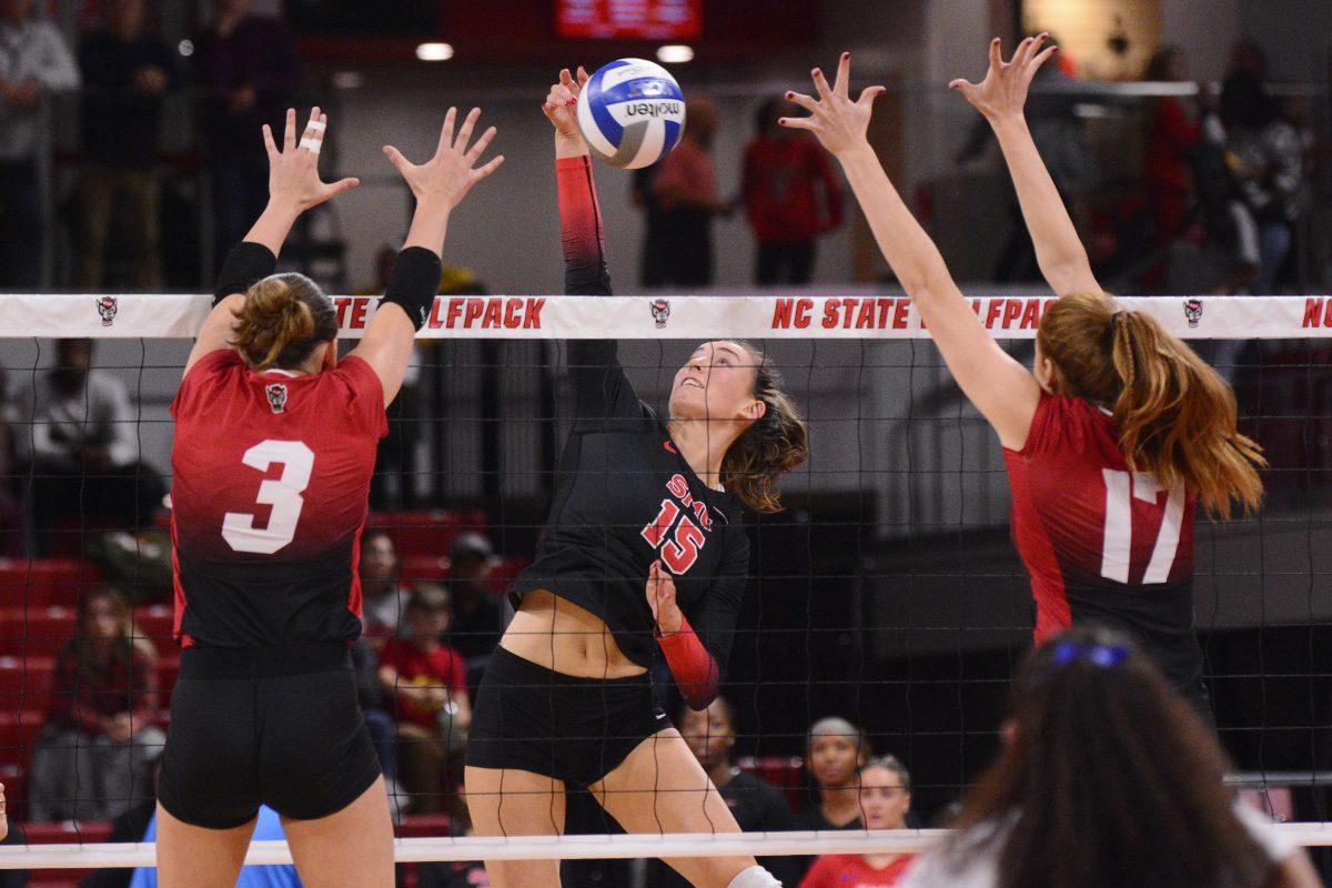 Sophomore outside hitter Clara Vondran and senior opposite Amanda Rice attempt to block an attack during the match against SMU at Reynolds Coliseum on Friday, Nov. 22, 2024. Combined, Vondran and Rice had six digs. The Wolfpack lost to the Mustangs 3-2.