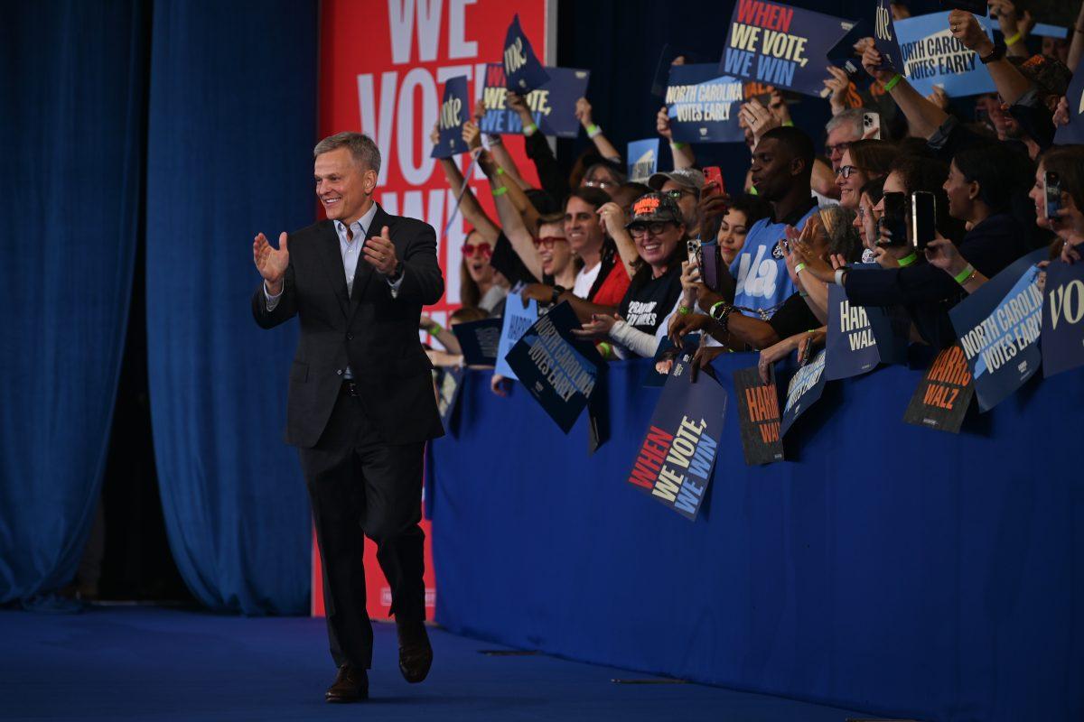 North Carolina Attorney General and gubernatorial candidate, Josh Stein, walks on stage during the Kamala Harris campaign rally at Coastal Credit Union Music Park at Walnut Creek on Wednesday, Oct. 31, 2024. Stein talked about the significance of voting for the national and local races like his own.
