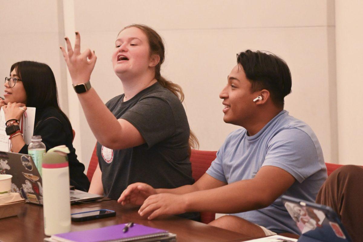 Katelyn Barron, a second-year studying chemistry, and Junior Torres Diaz, a first-year studying agriculture education reacts to live election at the NCSU Democrats election night watch party in Talley Student Union on Tuesday, Nov. 5. 2024. This event was hosted by NCSU democrats to disscuss the election results as they unfolded.