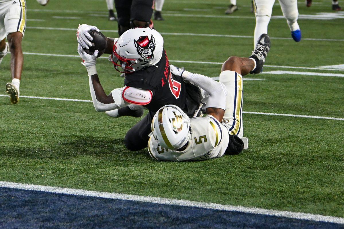 Sophomore running back Kendrick Raphael dives for the end zone during the game against Georgia Tech in Bobby Dodd Stadium at Hundai Field in Atlanta on Thursday, Nov. 21, 2024. Raphael rushed nine times for a total of 78 yards. NC State lost to Georgia Tech 30-29.