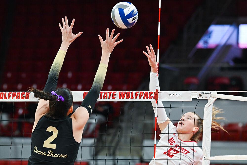 Junior outside hitter Courtney Bryant spikes the ball during the match against Wake Forest in Reynolds Coliseum on Wednesday, Nov. 13, 2024. Bryant scored 13 points during the match. NC State beat Wake Forest 3-0.
