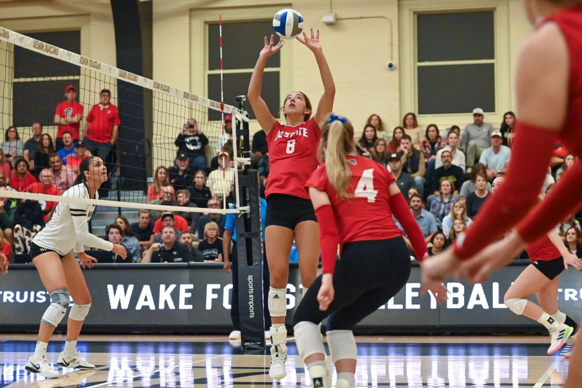Graduate setter Naomi Cabello sets the ball during the match against Wake Forest at Reynolds Gymnasium in Winston-Salem on Saturday, Nov. 16, 2024. Cabello had 14 digs. NC State won against Wake Forest 3-2.