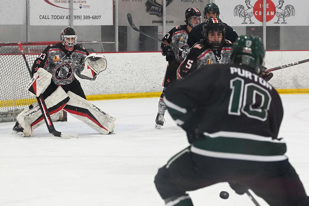 Senior goalie Addison Lawrence, graduate defender Ricky Frosch and freshman defender Jackson Weglarz defend the goal as a Michigan State opponent makes a shot on the goal during the game against Michigan State at the Invisalign Arena on Friday, Nov. 8, 2024. NC State beat Michigan State 4-2.