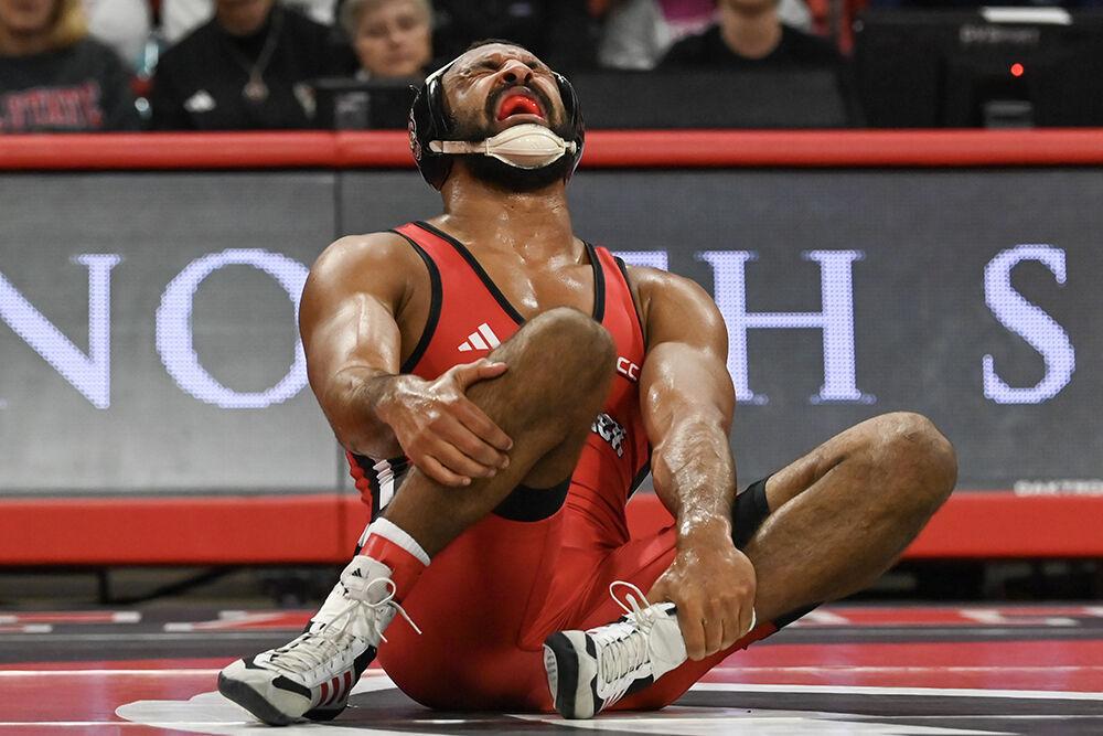 Redshirt senior Christian Knop gets injured during the duel against Appalachian State in Reynolds Coliseum on Friday, Nov. 15, 2024. Knop forfieted the 197 bout. NC State beat App State 34-12.