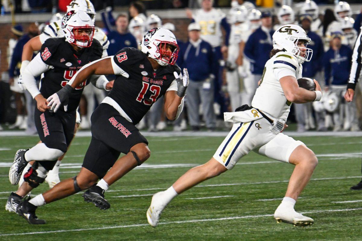 Redshirt junior defensive end Travali Price chases the ball carrier during the game against Georgia Tech in Bobby Dodd Stadium at Hundai Field in Atlanta on Thursday, Nov. 21, 2024. Travali had four total tackles. NC State lost to Georgia Tech 30-29.