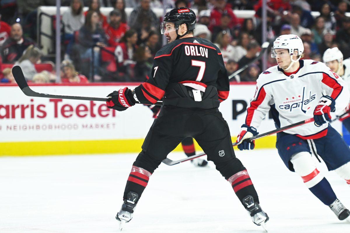 Defenseman Dmitri Orlov watches the puck during the Carolina Hurricanes game versus the Washington Capitals at PNC Arena on Friday, April 5, 2024. The Hurricanes beat the Capitals 4-2.
