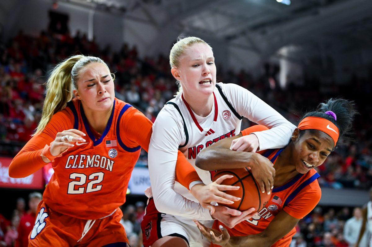 Freshman forward Tilda Trygger fights for a loose ball during the game against Clemson in Reynolds Coliseum on Sunday, Dec. 29, 2024. Trygger scored six points. The Wolfpack beat the Tigers 83-79.