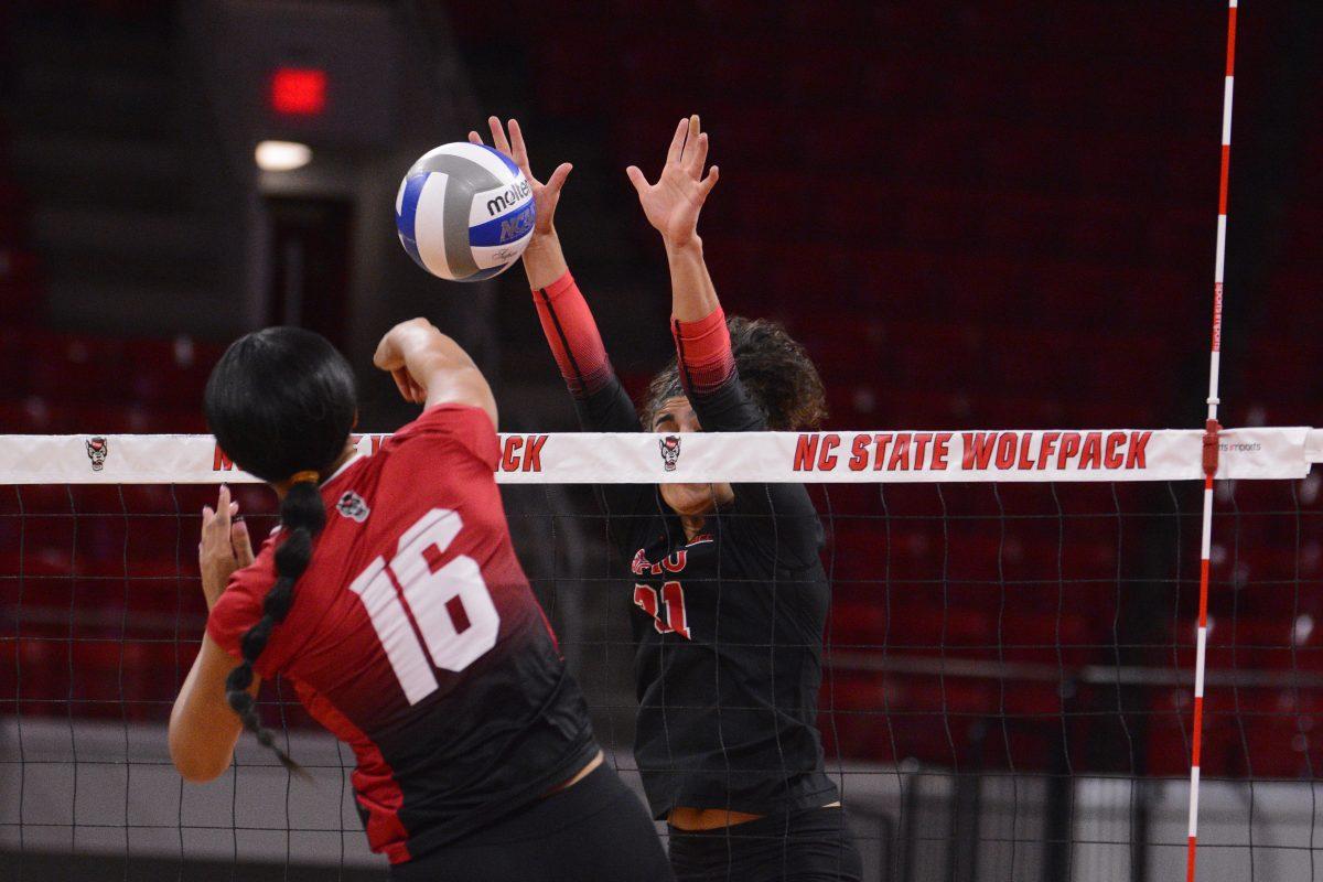 Senior middle blocker Jada Allen prepares to attack the ball during the match against SMU at Reynolds Coliseum on Friday, Nov. 22, 2024. Allen had one assist and two digs. The Wolfpack lost to the Mustangs 3-2.