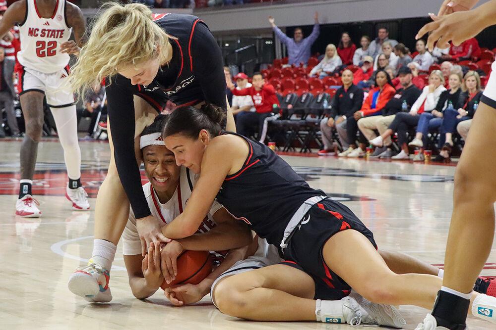 Sophomore guard Zoe Brooks fights for the ball in the game against Davidson College on Wednesday, Dec. 11, 2024. NC State won the game 59-57.