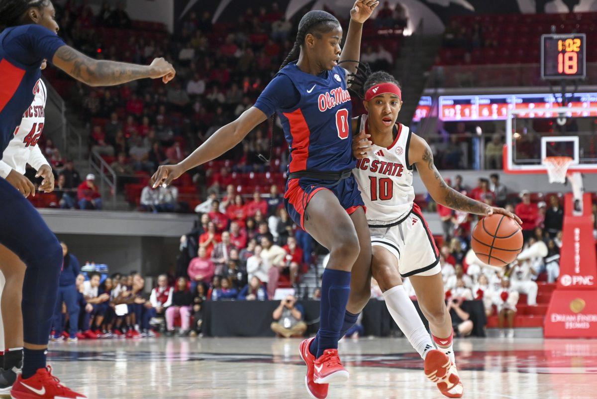 Senior guard Aziaha James drives down the court during the women's basketball game against Ole Miss in Reynolds Coliseum on Thursday, Dec. 5, 2024. James scored 11 points and had four steals. NC State beat Ole Miss 68-61.