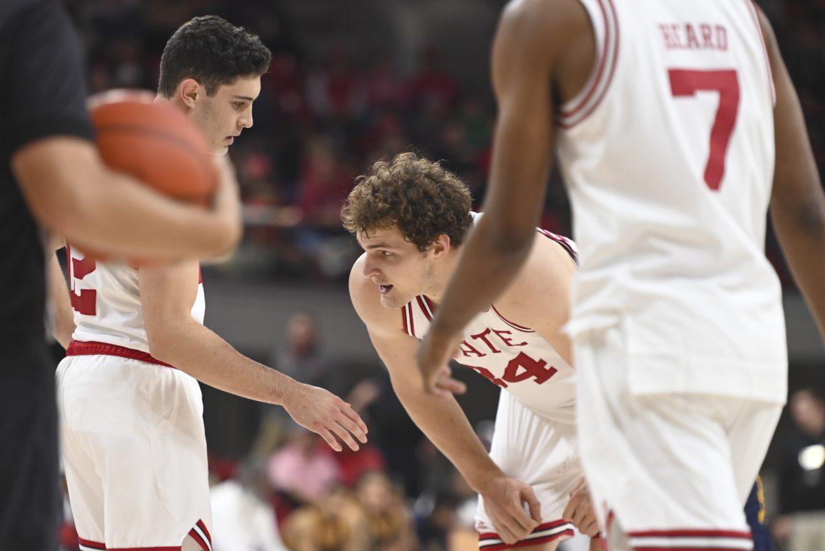 Senior forward Ben Middlebrooks rests his hands on his knees after being fouled team during the men's basketball game against Coppin State in Reynolds Coliseum on Tuesday, Dec. 11, 2024. Middlebrooks made seven out of nine free throws. Middlebrooks had the most free throw attempts on the team. NC State beat Coppin State 66-56.