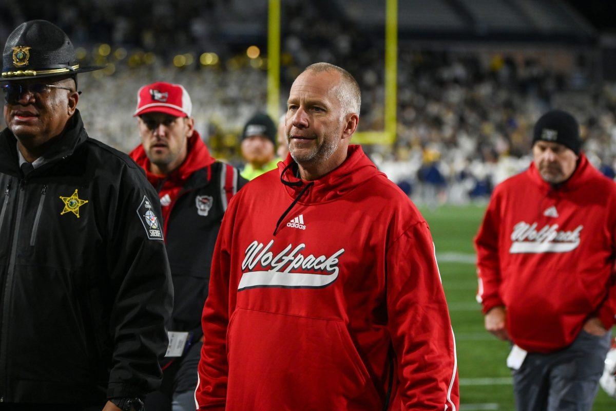 NC State head coach Dave Doeren exits the field after the game against Georgia Tech in Bobby Dodd Stadium at Hundai Field in Atlanta on Thursday, Nov. 21, 2024. NC State lost to Georgia Tech 30-29.