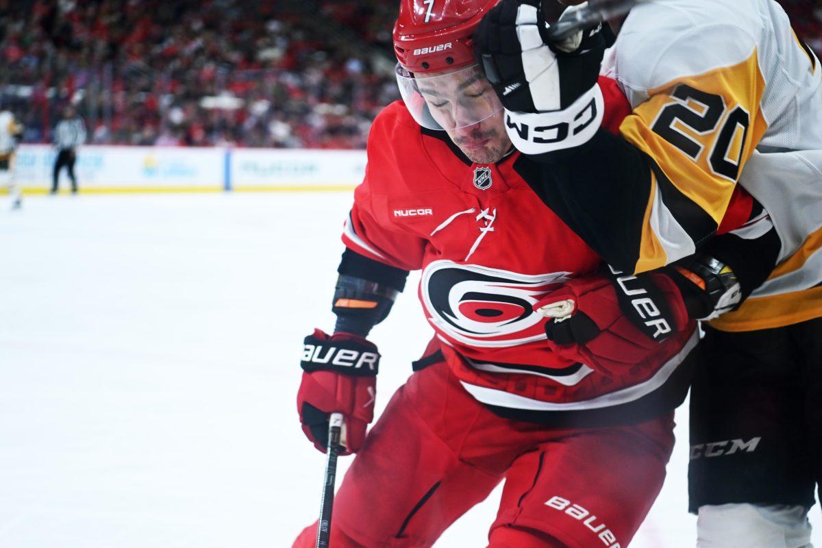 Defenseman Dmitri Orlov collides with an opponent during the game versus the Pittsburgh Penguins at Lenovo Center on Thursday, Nov. 7, 2024. The Hurricanes beat the Penguins 5-1.