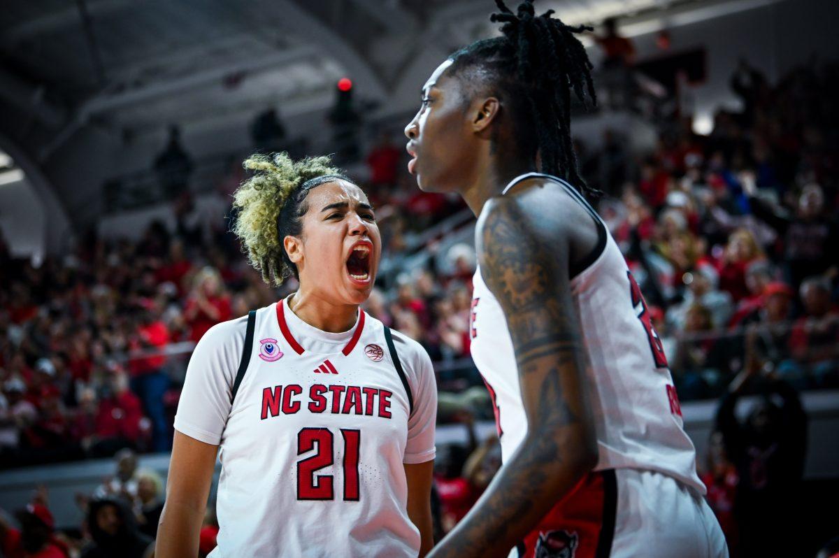 Senior guard Madison Hayes yells at fellow senior guard Saniya Rivers after an and-one during the game against Clemson in Reynolds Coliseum on Sunday, Dec. 29, 2024. Hayes led the team with 19 points. Rivers scored 14. The Wolfpack beat the Tigers 83-79.