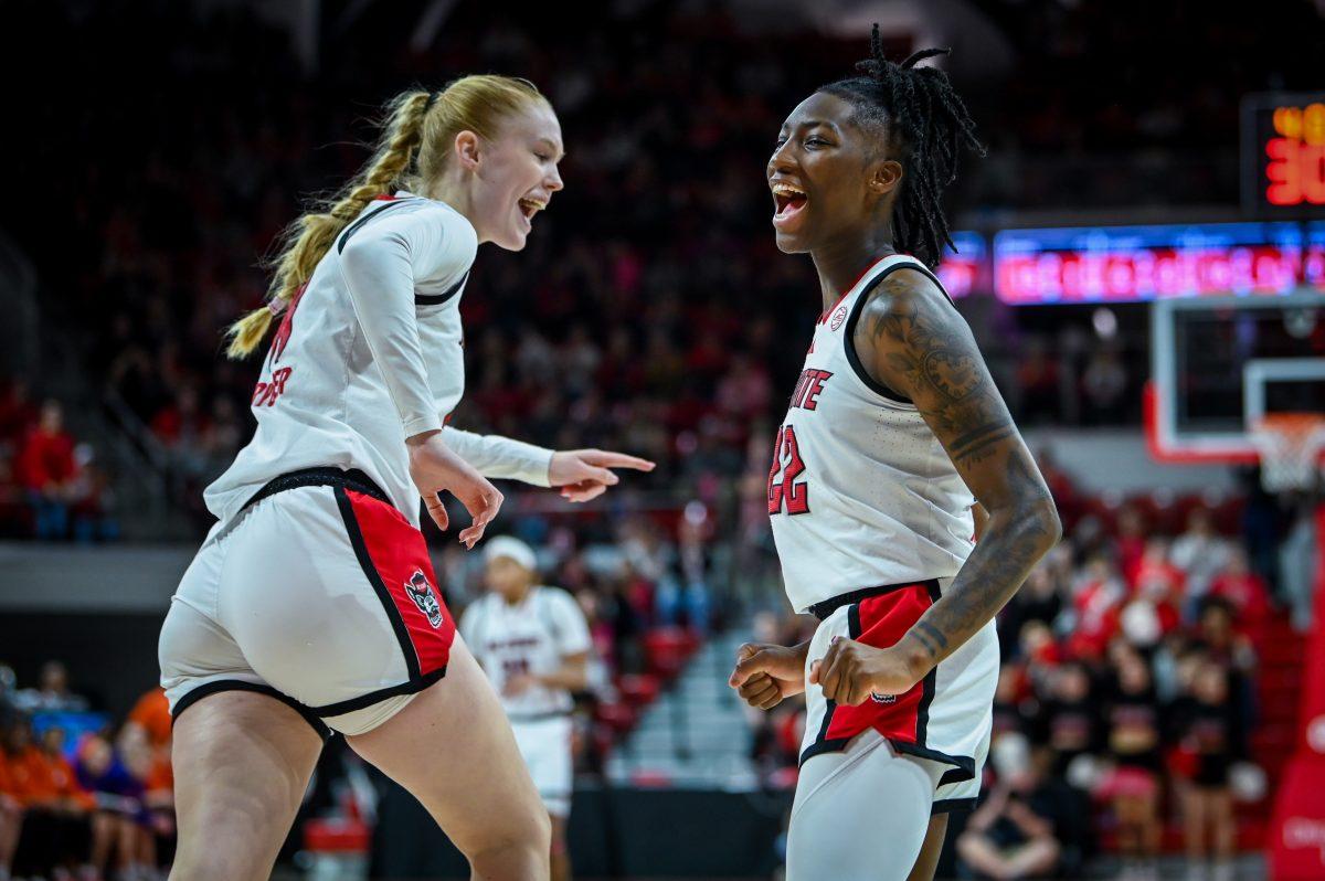 Freshman forward Tilda Trygger (left) and senior guard Saniya Rivers (right) cheer after a basket during the game against Clemson in Reynolds Coliseum on Sunday, Dec. 29, 2024. The Wolfpack beat the Tigers 83-79.