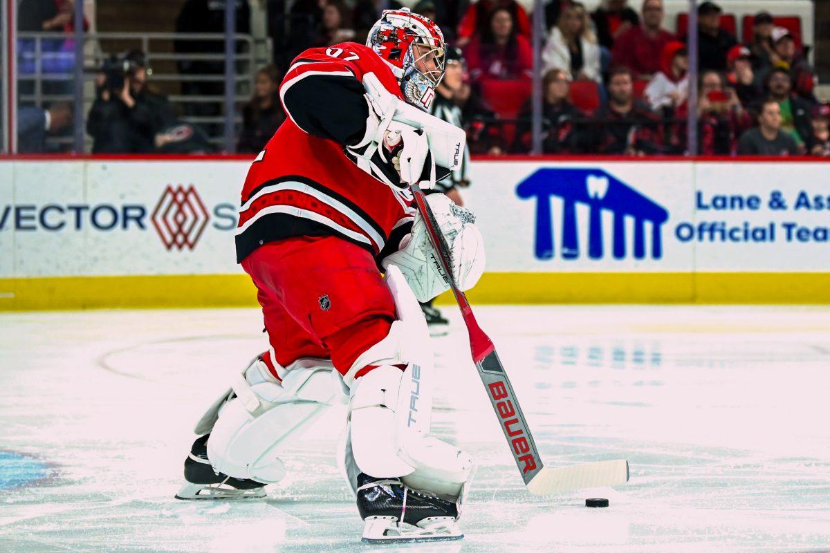 Goalie Pyotr Kochetkov passes the puck in the Carolina Hurricanes game versus the Winnipeg Jets at PNC Arena on Saturday, March 2, 2024.&#160;The Jets beat the Hurricanes 5-3.