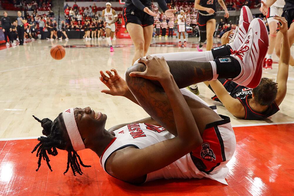 Senior guard Saniya Rivers winces in pain during the game against Davidson College on Wednesday, Dec. 11, 2024. Rivers recorded a double-double with 25 points and 11 rebounds. NC State beat Davidson College 59-57.