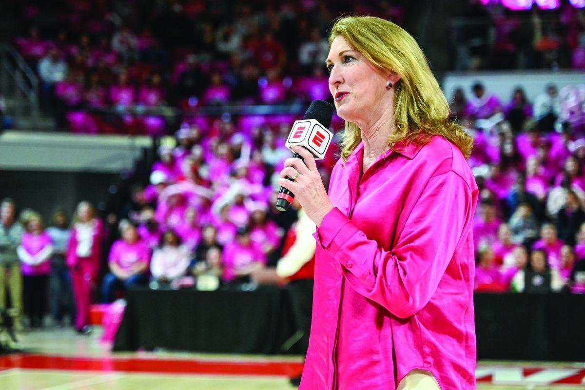 Debbie Antonelli, NC State women's basketball guard from 1982-86 and color commentator for ESPN, introduces the halftime recognition of women who have survived breast cancer and their stories during halftime in the game against Louisville in Reynolds Coliseum on Monday, Feb. 5, 2024. NC State beat Louisville 77-67.