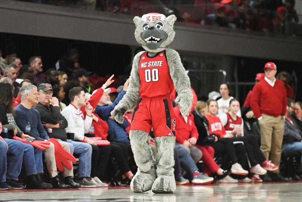 Mr. Wuf walks across the court during a timeout in the game against Pitt in Reynolds Coliseum on Thursday, Jan. 16, 2025. The Wolfpack beat the Panthers 83-67.