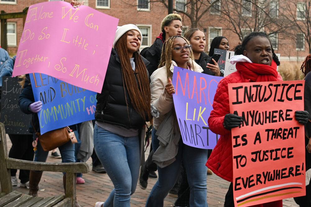 Marchers chant and display their signs while marching during March Like Martin form Stafford Commons to Harris Field on Friday, Jan. 24, 2025. This year marked the fourth annual March Like Martin event.