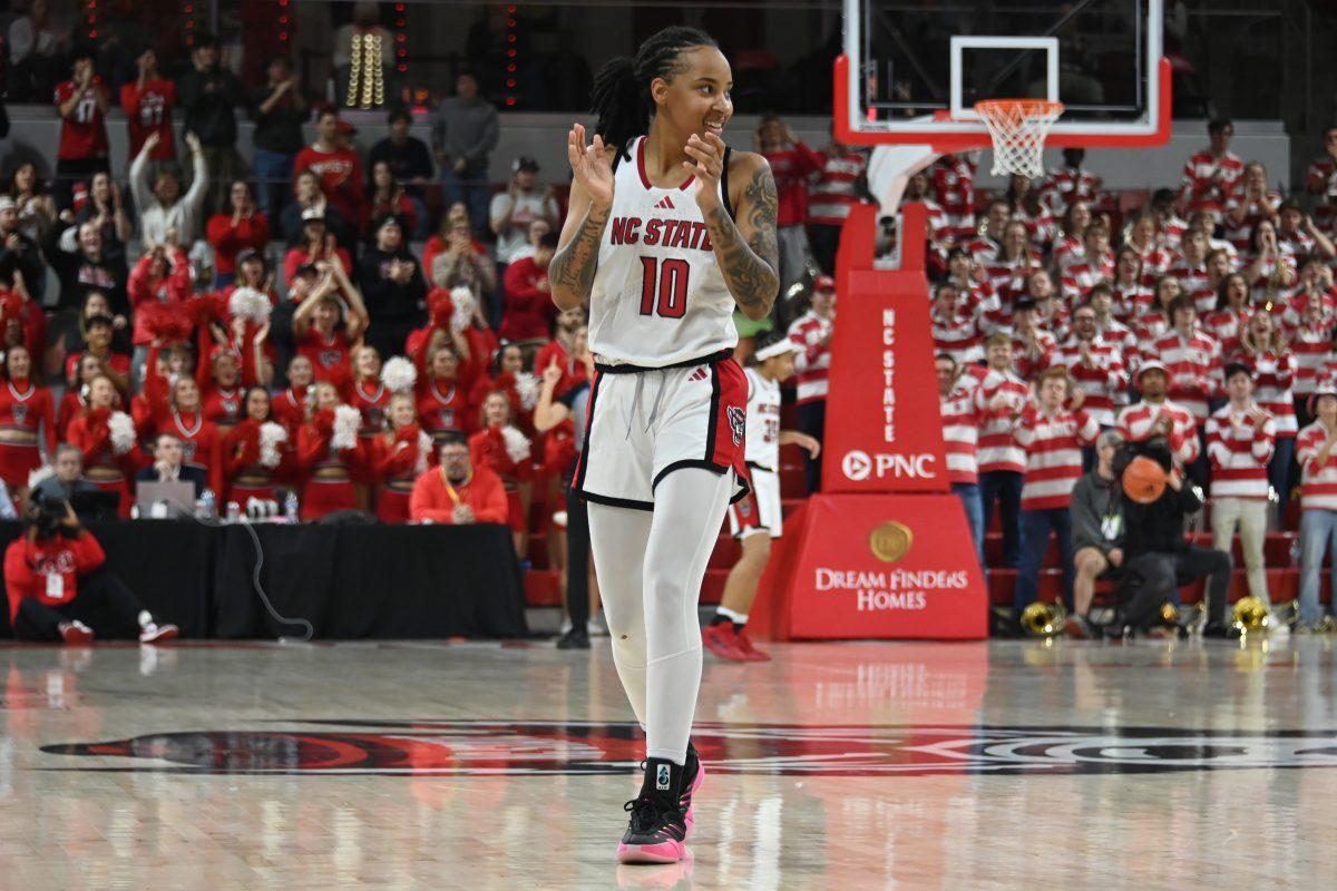 Senior guard Aziaha James celebrates on the court during the match against Virginia Tech in Reynolds Coliseum on Sunday, Jan. 26, 2025. James had five rebounds and scored 25 points. The Wolfpack beat the Hokies 85-57.