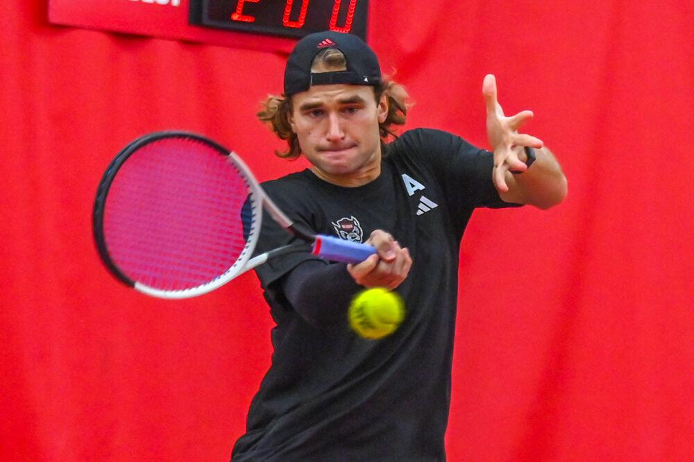 Junior Martin Borisiouk returns the ball in his doubles game with senior Luca Staeheli against NC Central at the J.W. Isenhour Tennis Center on Saturday, Jan. 18, 2025. Borisiouk and Staeheli won their doubles match 5-3 (unfinished). NC State won the match 7-0.