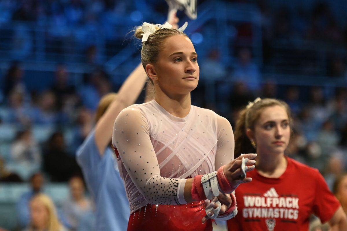 Senior Payton Childs prepares for her uneven bars routine during the meet against UNC-Chapel Hill in Carmichael Arena on Friday, Jan. 24, 2025. Childs scored a 9.800 average on the uneven bars. NC State beat UNC 196.350-195.925.