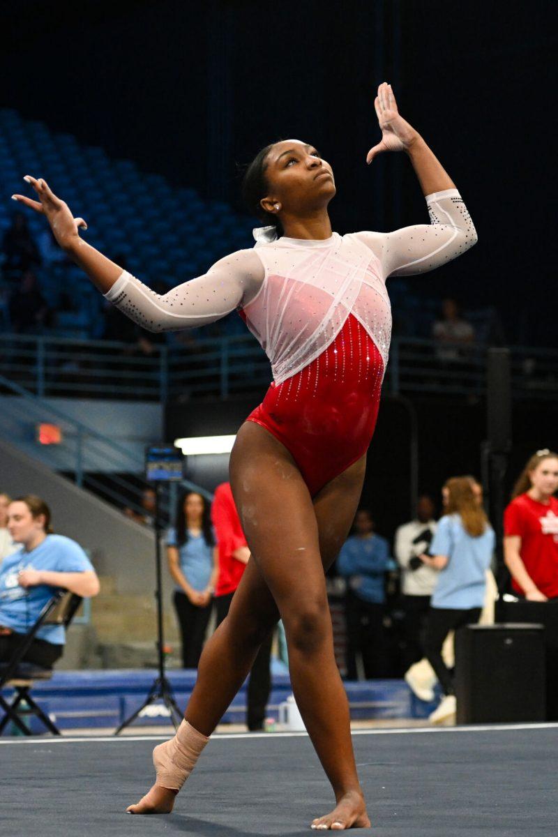 Freshman Syniya Thomas performs her floor routine during the meet against UNC-Chapel Hill in Carmichael Arena on Friday, Jan. 24, 2025. Thomas earned a 9.875 on her floor routine. The Wolfpack beat the Tar Heels 196.350-195.925.