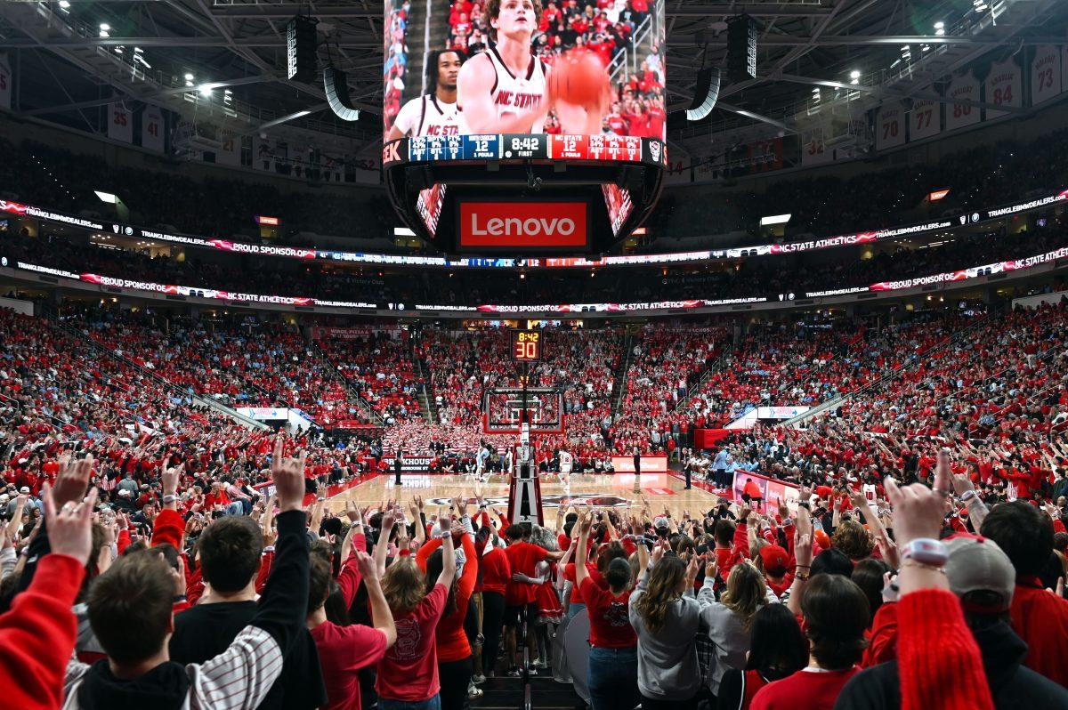 NC State students cheer on a free throw during their game against the UNC Tar Heels at the Lenovo Center on Saturday, Jan. 11, 2025. The center had a sold-out audience for the much-anticipated rivalry game. The Tar Heels defeated the Wolfpack 63-61.